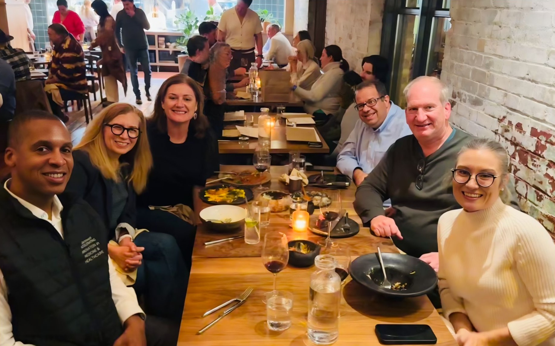Ronald Dixon, at left, with members of CareHive’s leadership around a restaurant table