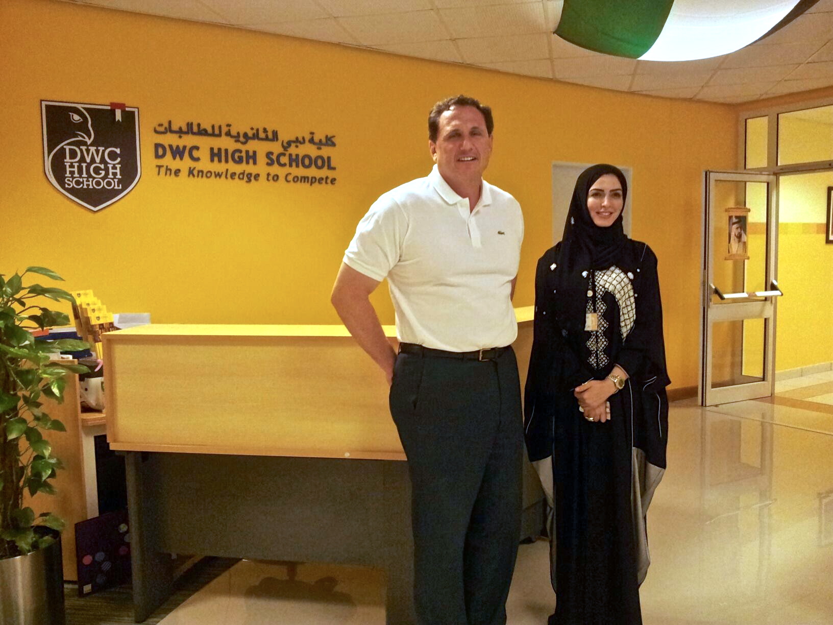 Ron Packard standing beside school leader Maya at Dubai Women’s College High School
