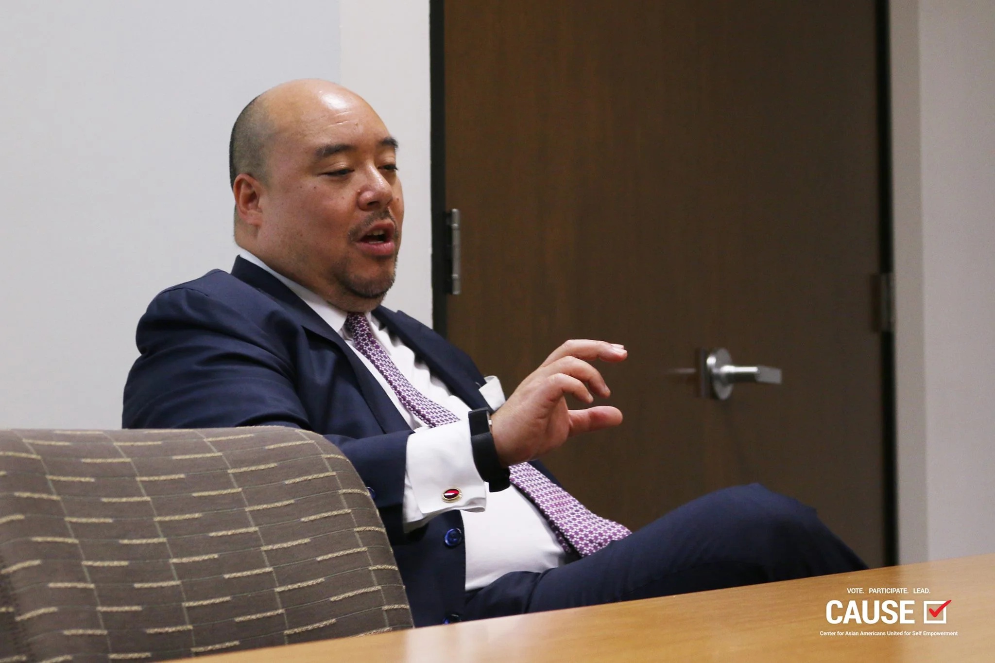 Ronald W. Wong gesturing while speaking at a CAUSE leadership workshop in 2017