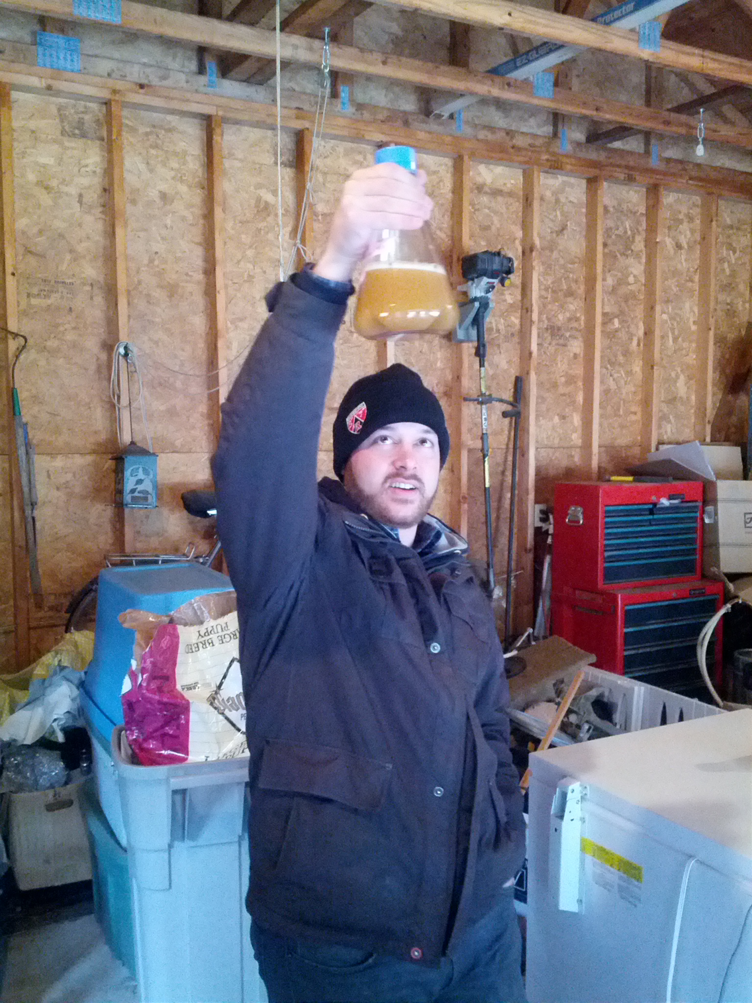 Ronn Friedlander inspecting home-grown yeast