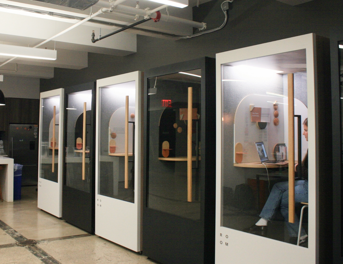 A row of ROOM Phone Booths inside the Bisnow office