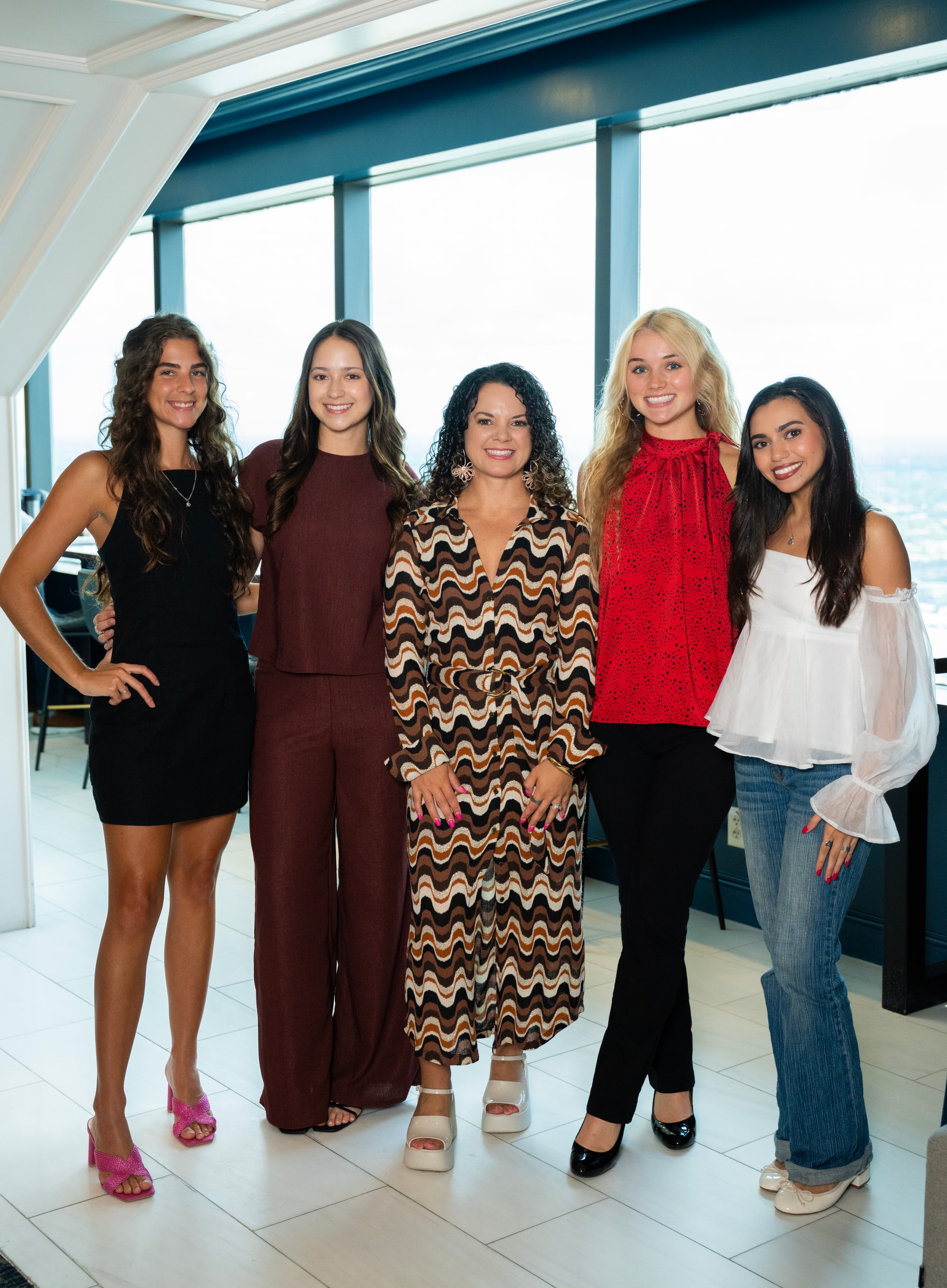 Members of the Rosarium team standing together at the Tampa Club