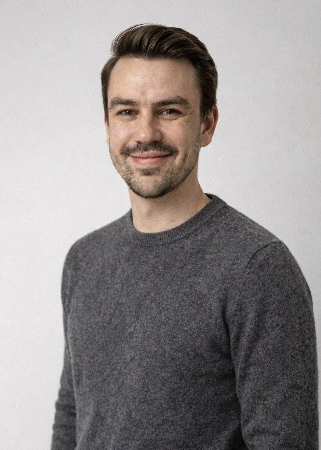Ross Durbin in a gray sweater, photographed for his Collage press headshot
