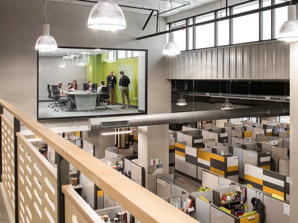An elevated view across Listrak’s open office and glass meeting spaces