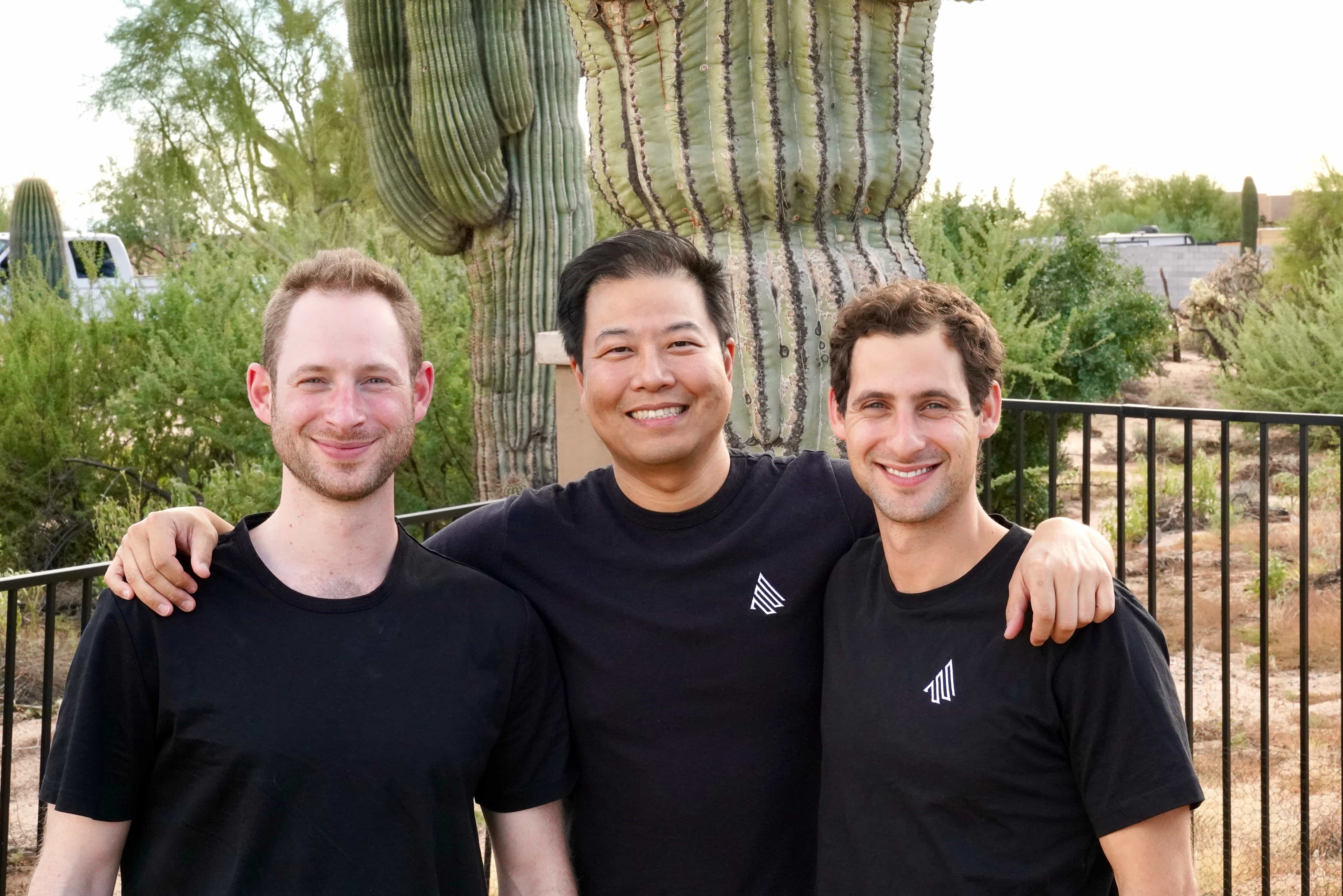 Accord founders Ryan Rich, Wayne Pan and Ross Rich standing together outdoors beside a cactus