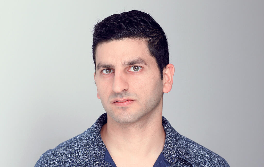 Rotem Alaluf in a patterned blue shirt in an earlier press photograph