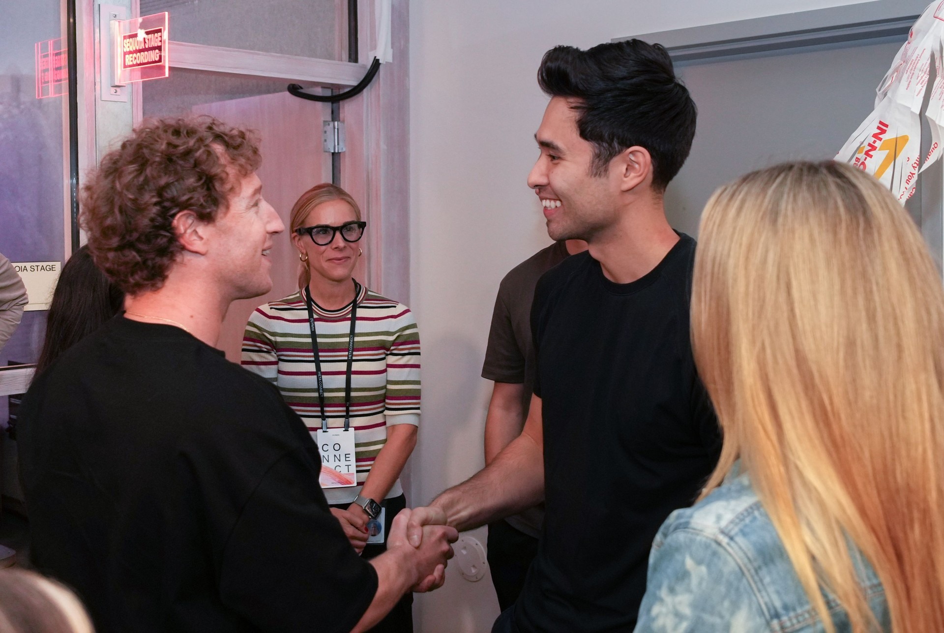 Rowan Cheung greeting Mark Zuckerberg at a Meta event