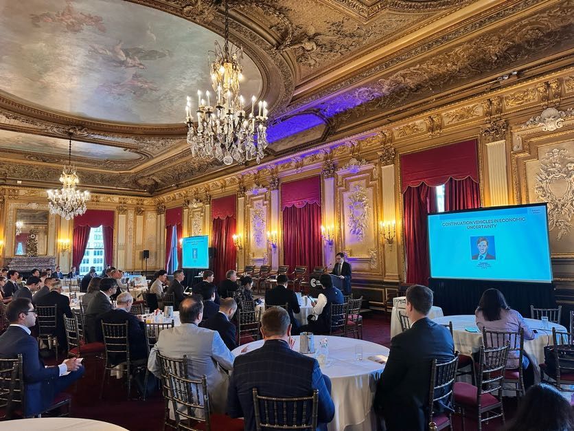 Participants listening to a panel in an ornate room at the Private Markets Secondaries Meeting East