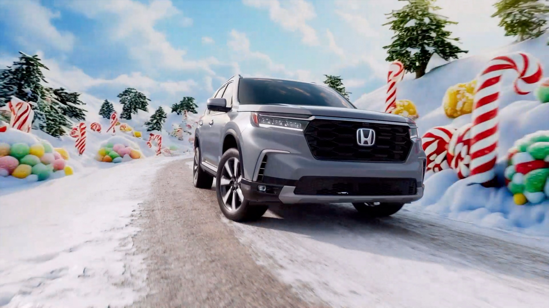 A Honda SUV drives through a whimsical winter landscape of candy canes and gumdrops in RPA's Happy Honda Days campaign
