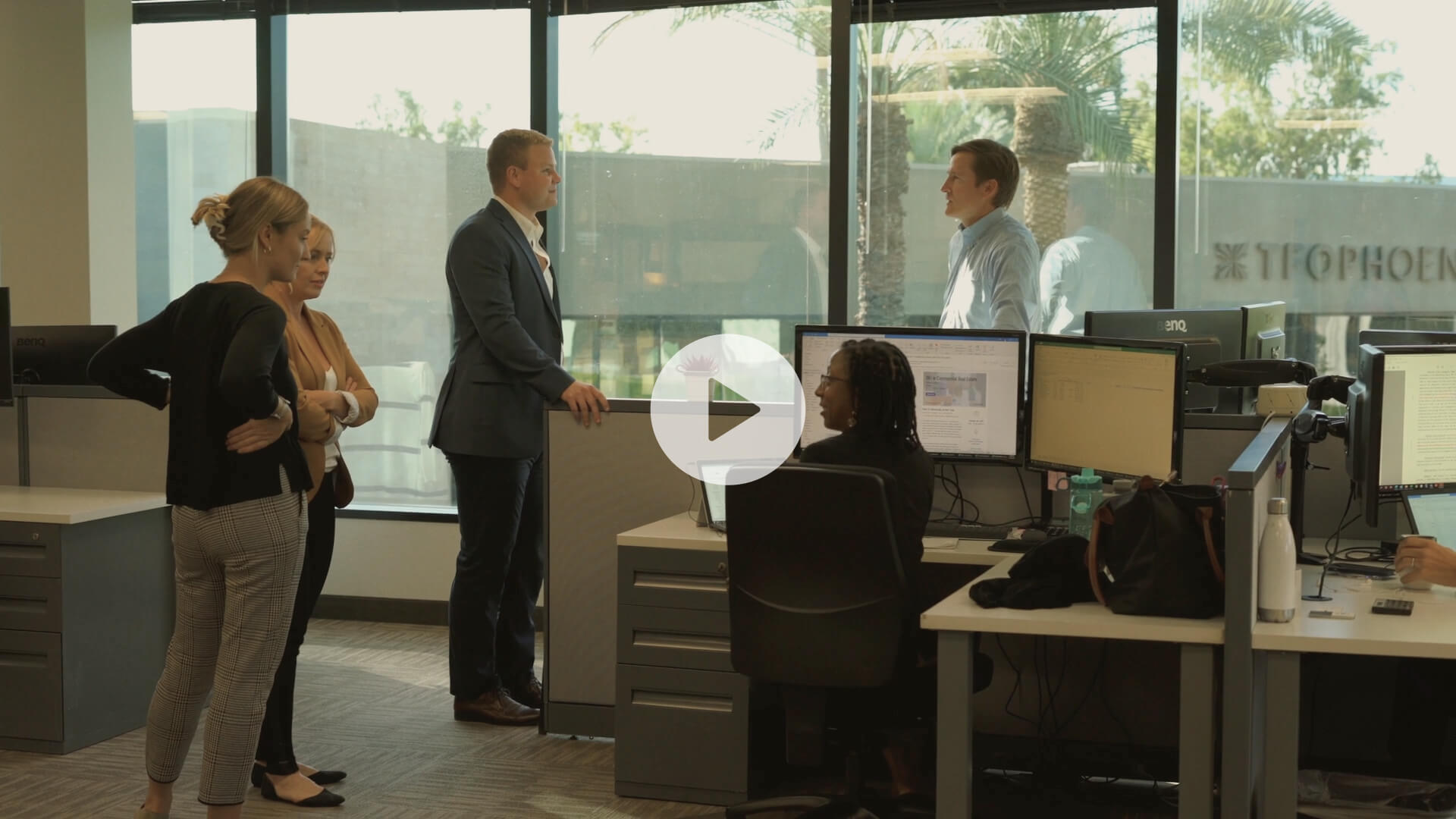 RRA Capital colleagues talking inside the firm's Phoenix office