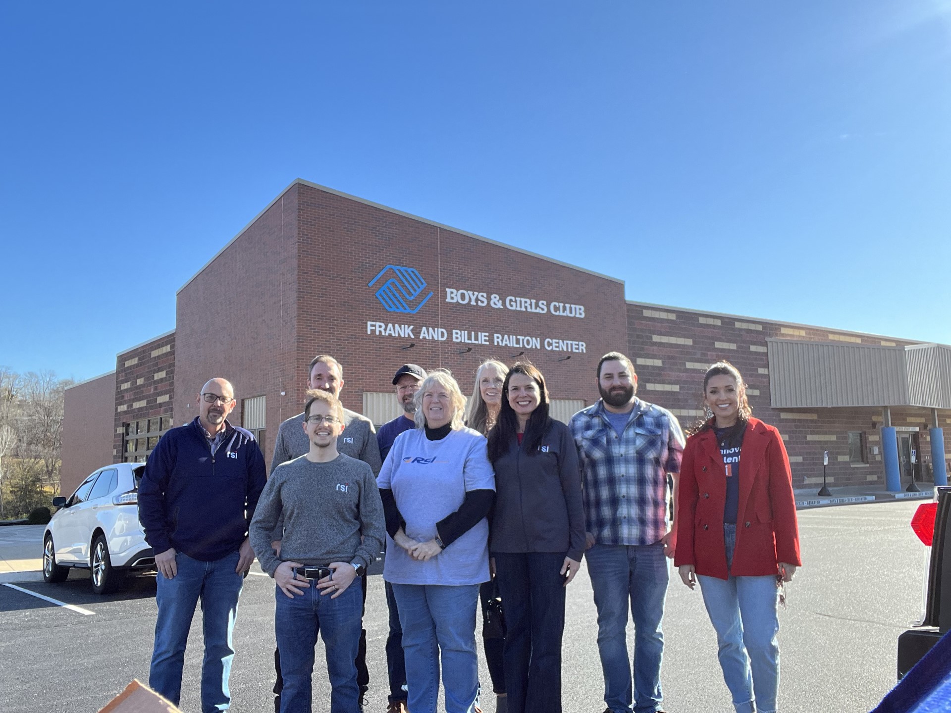 RSI volunteers gathered outside a Boys and Girls Club building