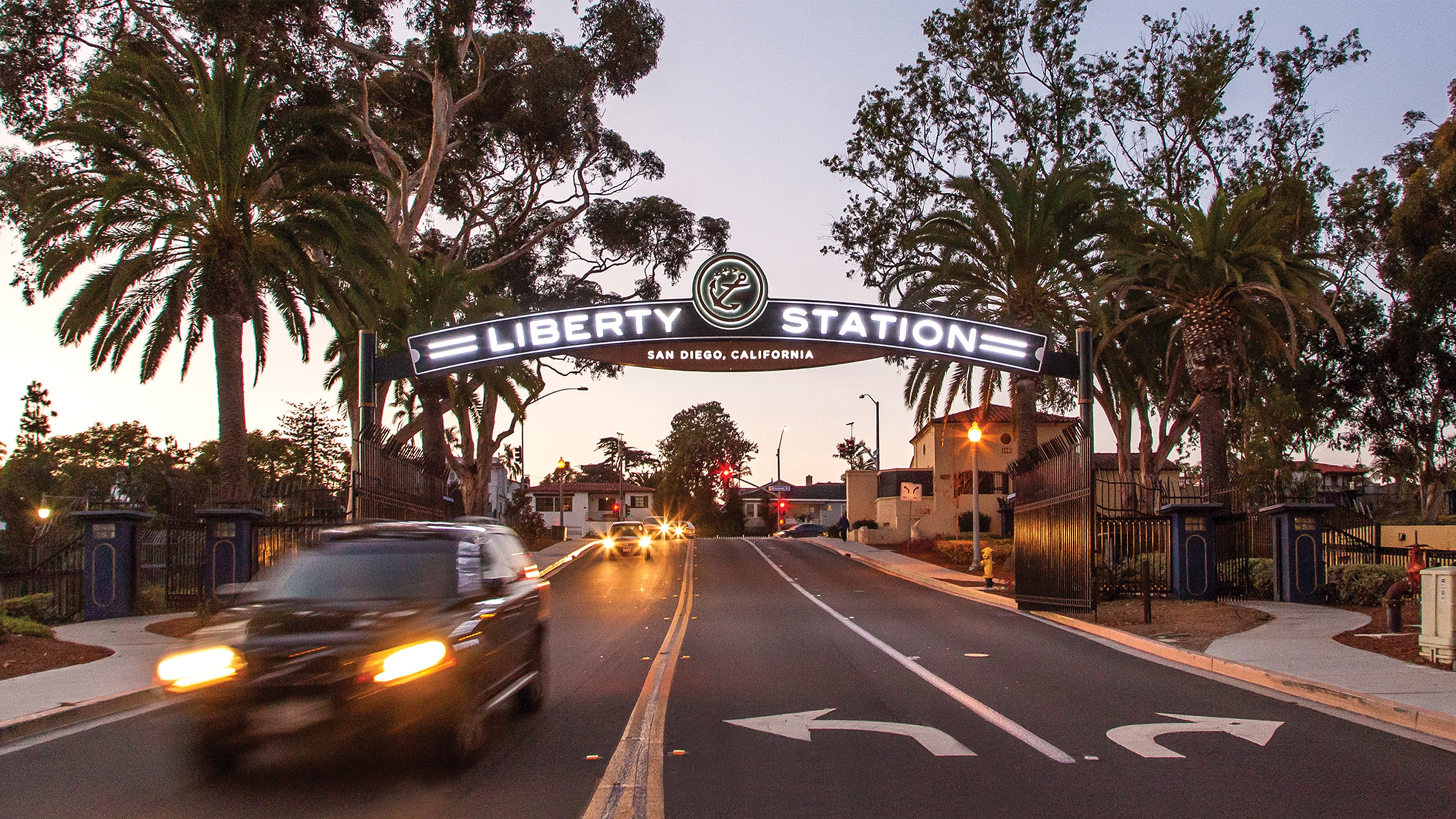Illuminated Liberty Station entrance gateway at dusk in San Diego