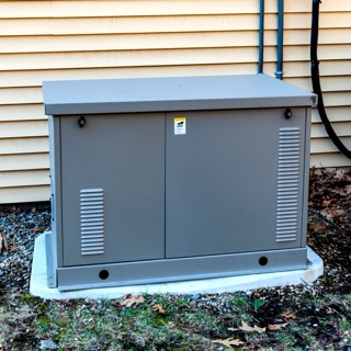 Residential standby generator beside a home, shown on RTO National’s generator program page