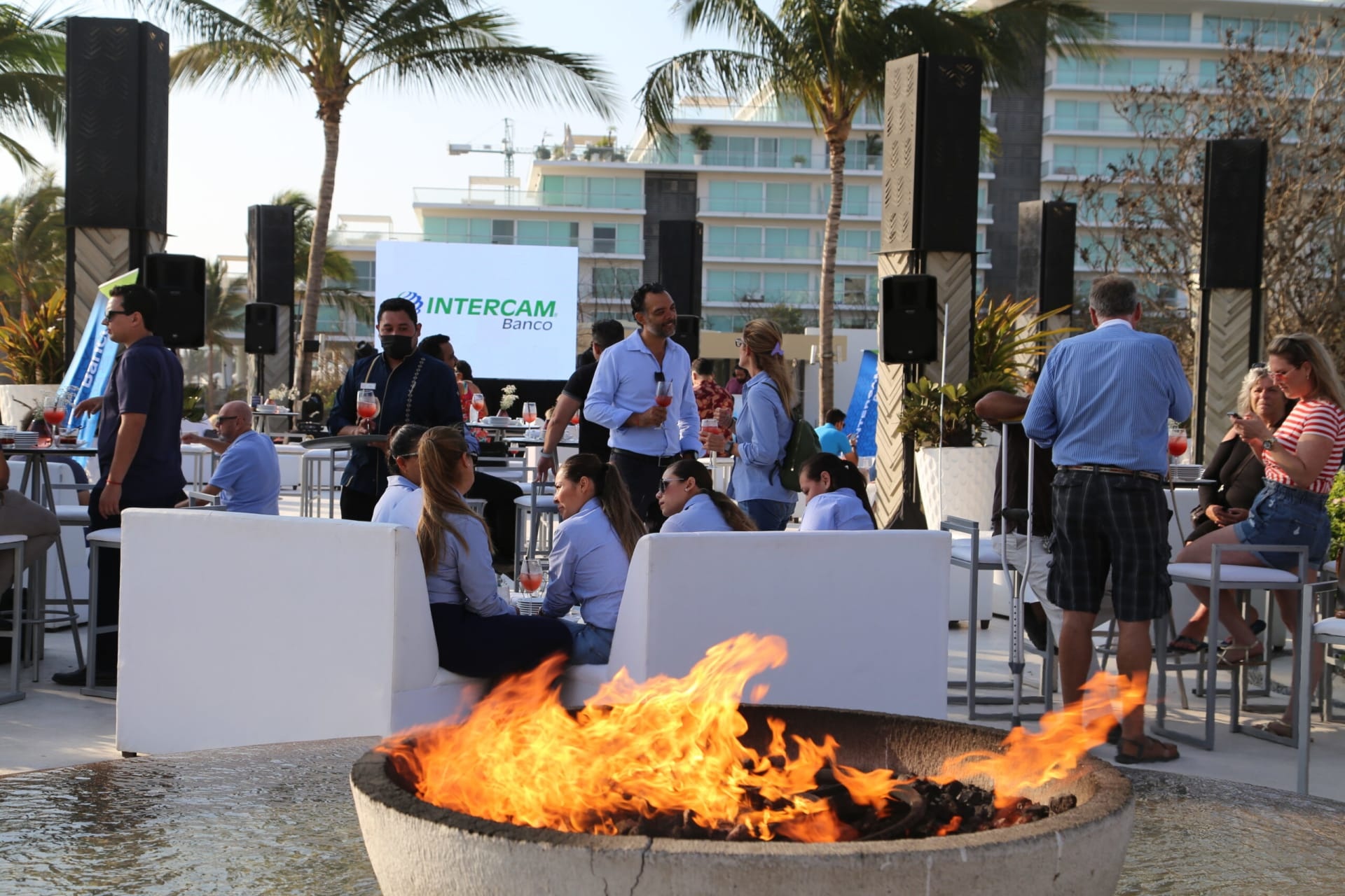 Guests talking at Intercam’s 2022 Dream Loan launch at Mozzamare in Nuevo Vallarta