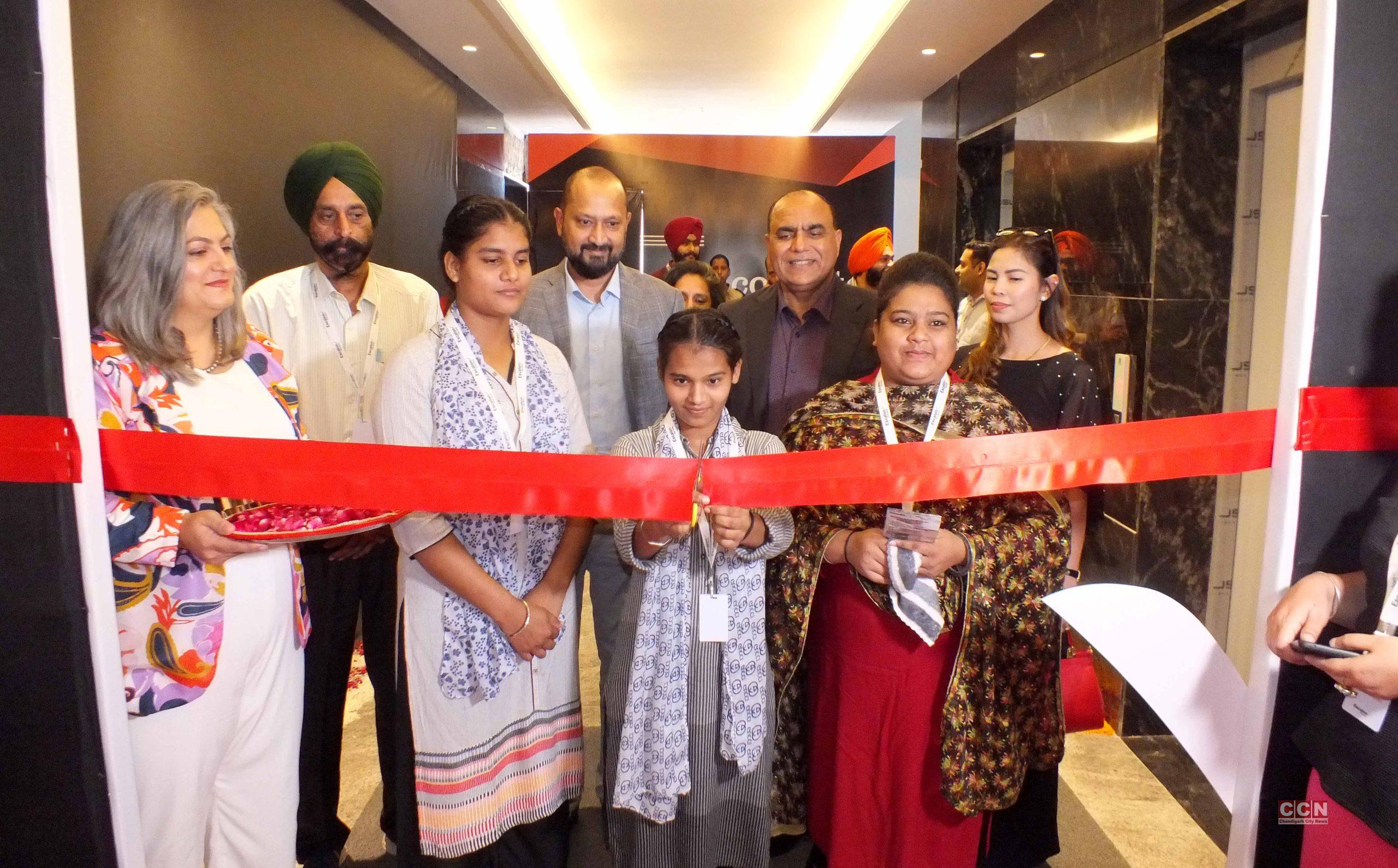 Ruby Sahiwal stands with colleagues and young women at Escalon’s Mohali office ribbon cutting in 2023