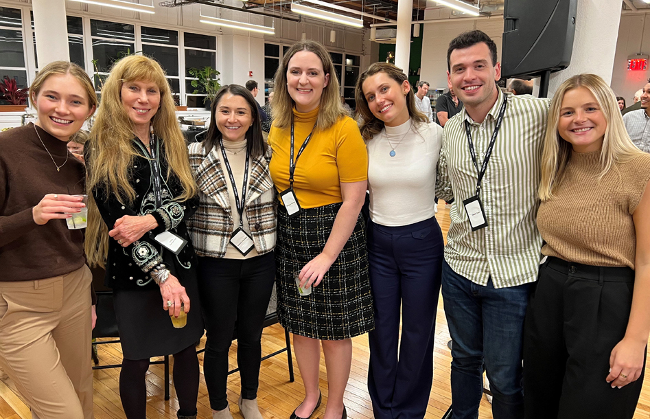 Ruder Finn employees gathered in a bright New York office