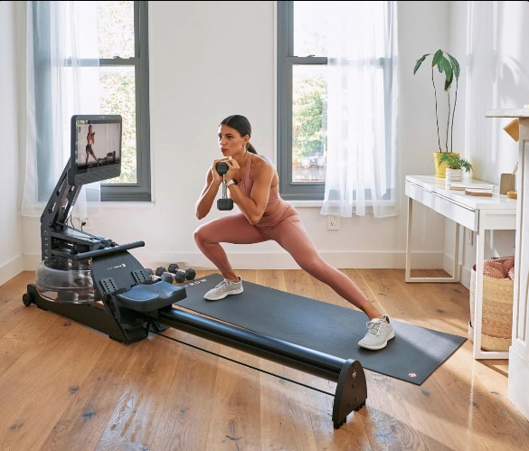 CityRow rowing machine with an attached workout tablet beside a person exercising