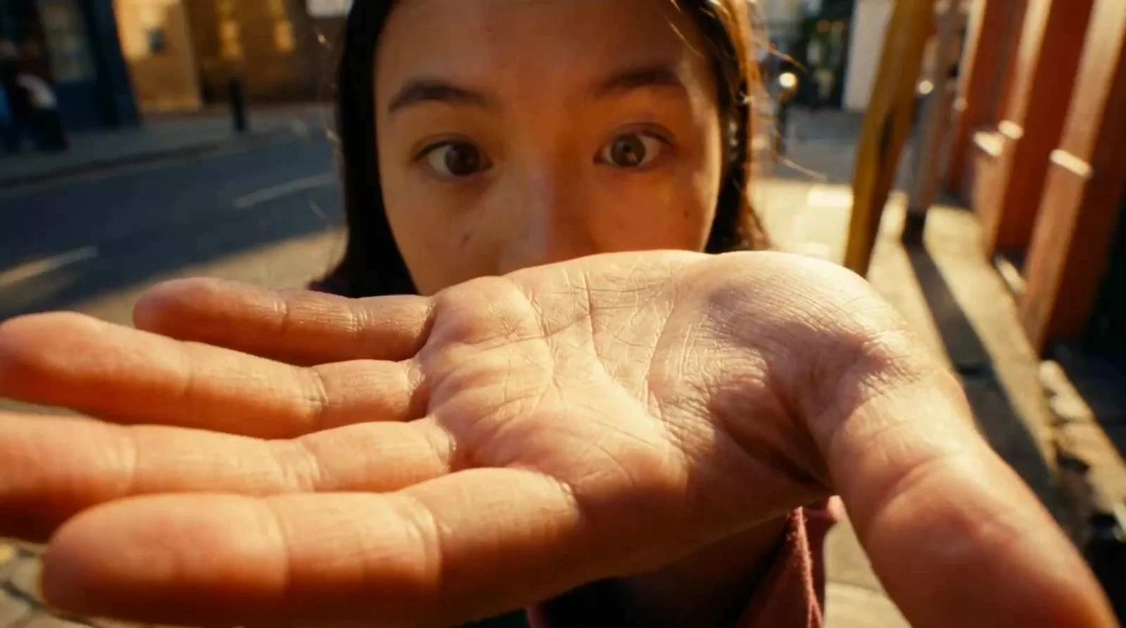 A close wide-angle frame of a person reaching toward the camera, from Runway's official Aleph 2.0 product presentation