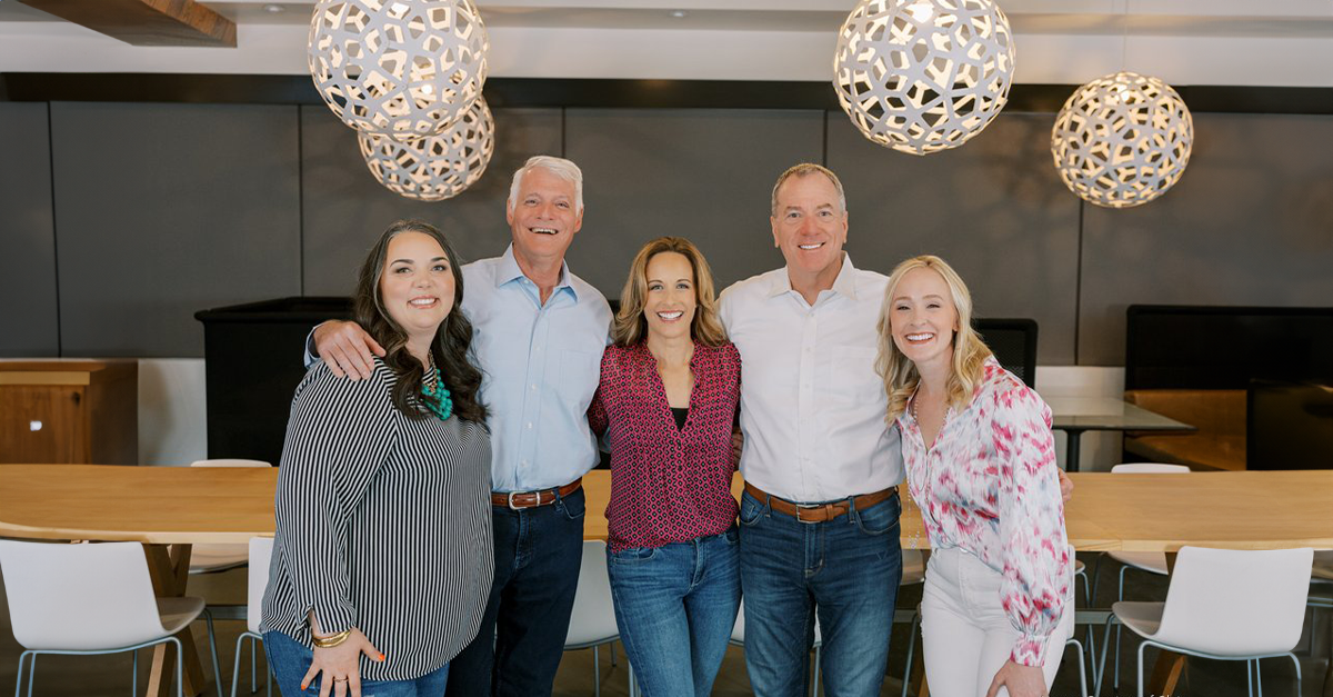 RSE leaders and new owners stand together in a modern office after the 2024 acquisition