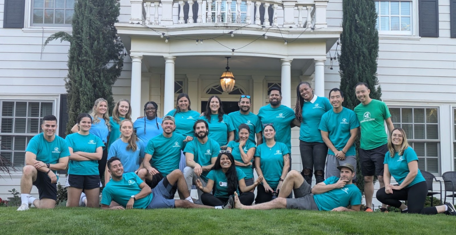 Rupa Chandra Gupta and her Sown To Grow colleagues gathered on a lawn in matching shirts