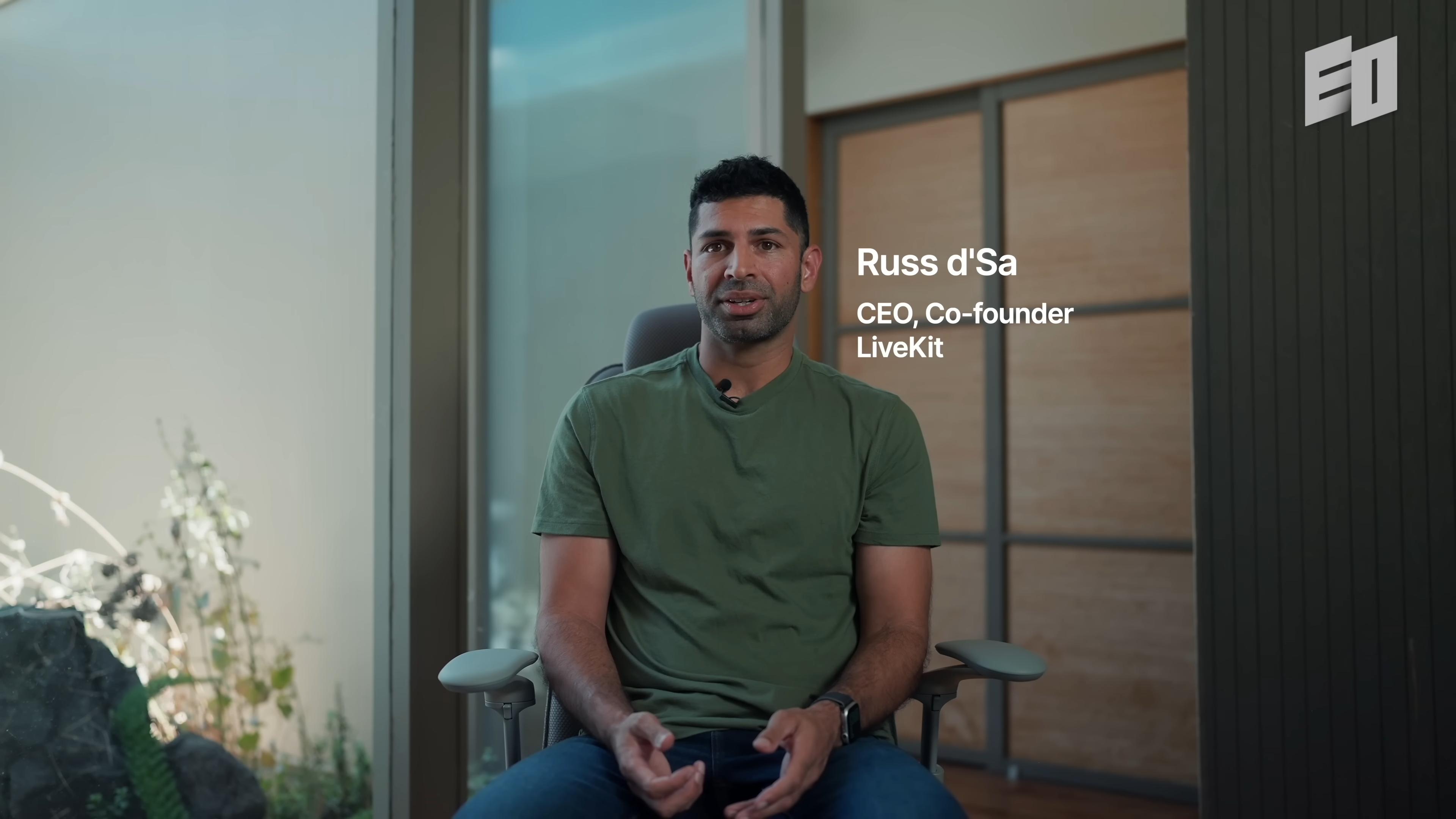Russ d'Sa seated for an EO interview