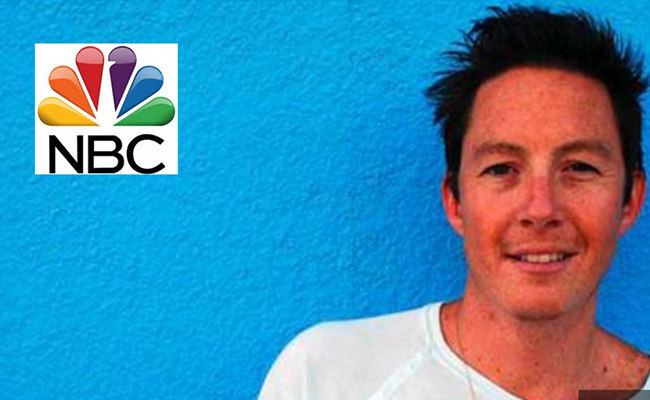 Russell Ward in an NBC LA press image against a bright blue background