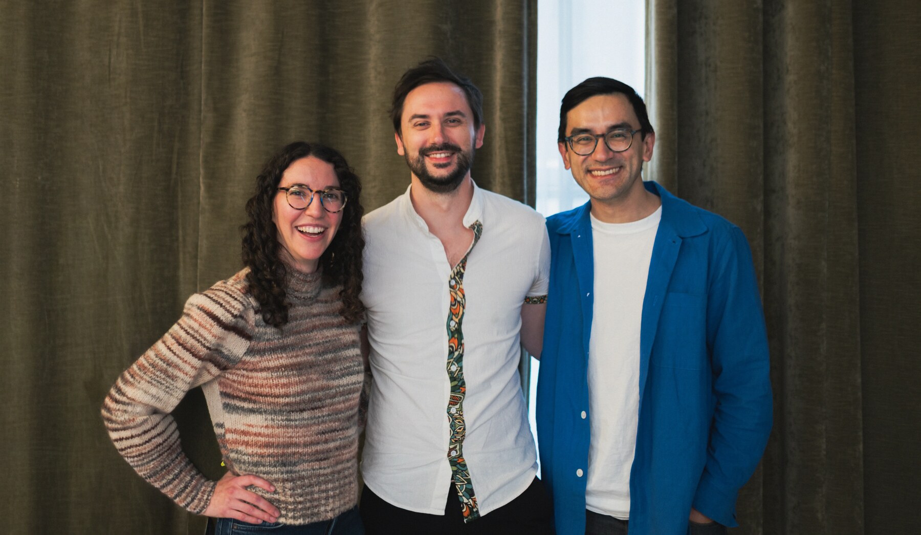 Lauren Reeder, Achille Roussel, and Rustam Lalkaka standing together and smiling