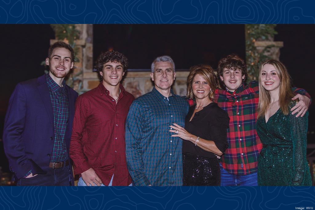 Rusty and Kimberly Hutson at center, standing with their four children