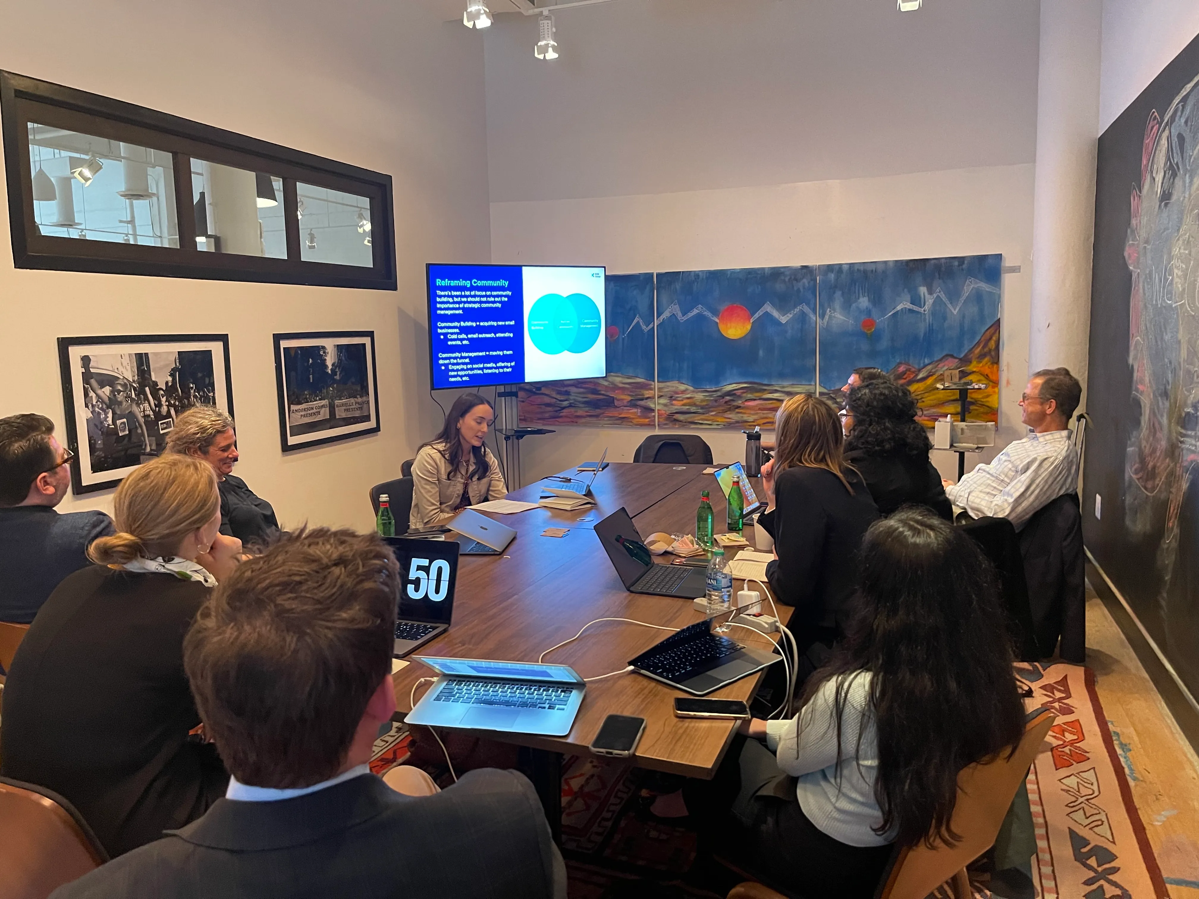 RXN colleagues gathered around a conference table during a team workshop in Washington, DC