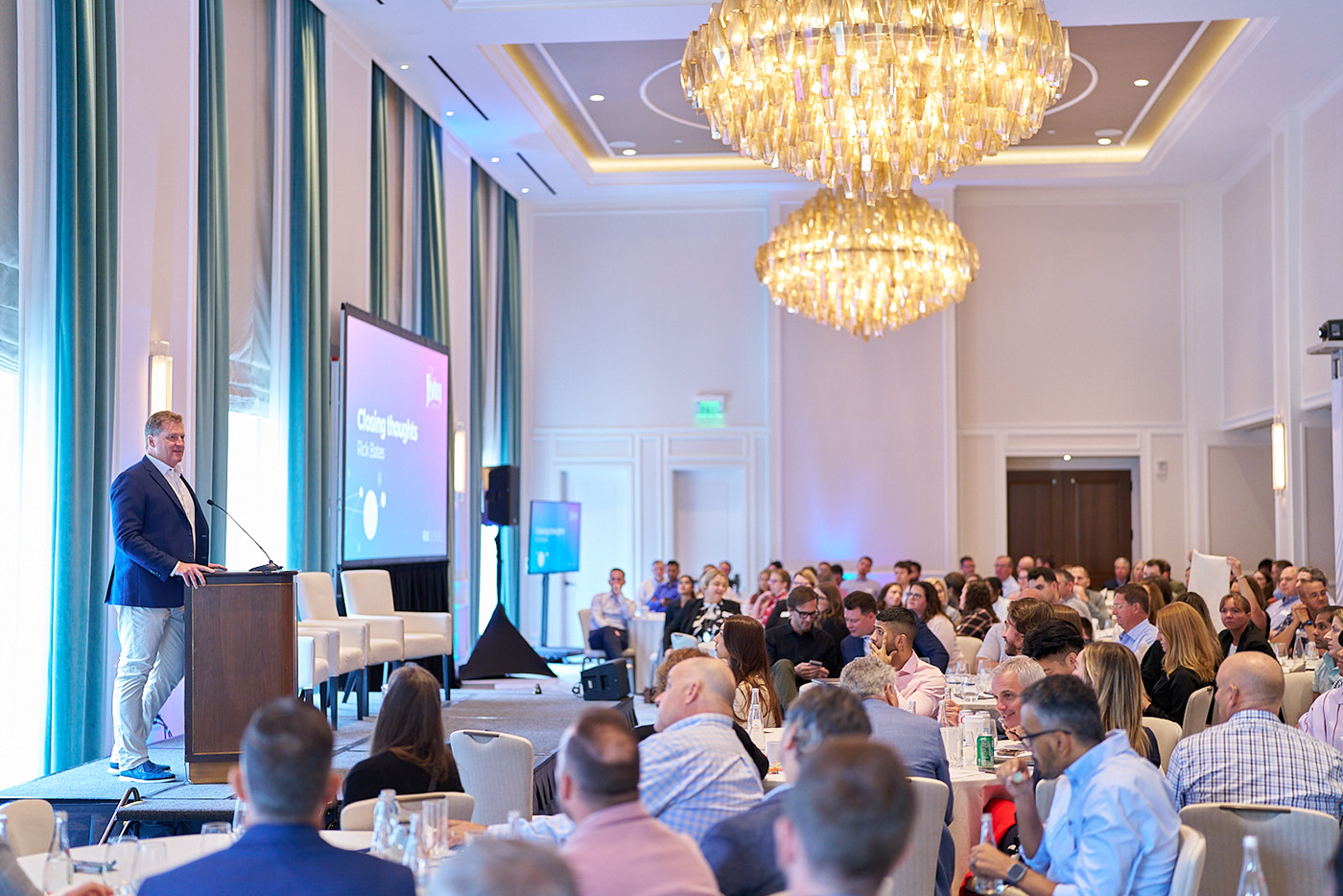 Rick Bates addressing employees at an RxSense company event in Boston