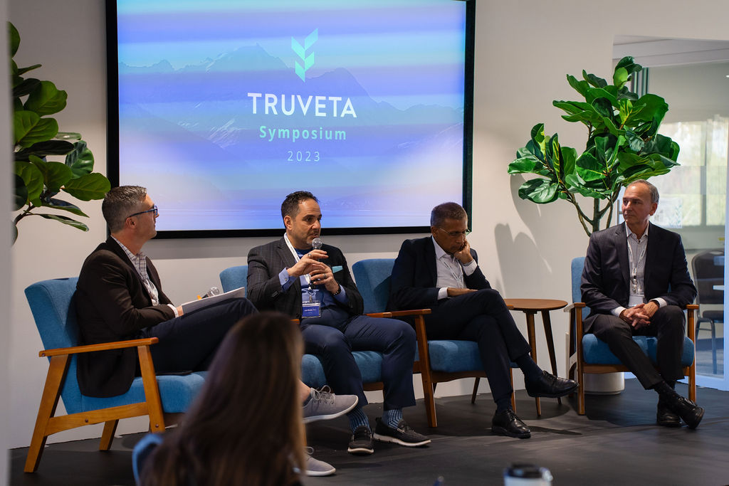Ryan Ahern, at left, listens to fellow panelists at Truveta’s 2023 symposium.