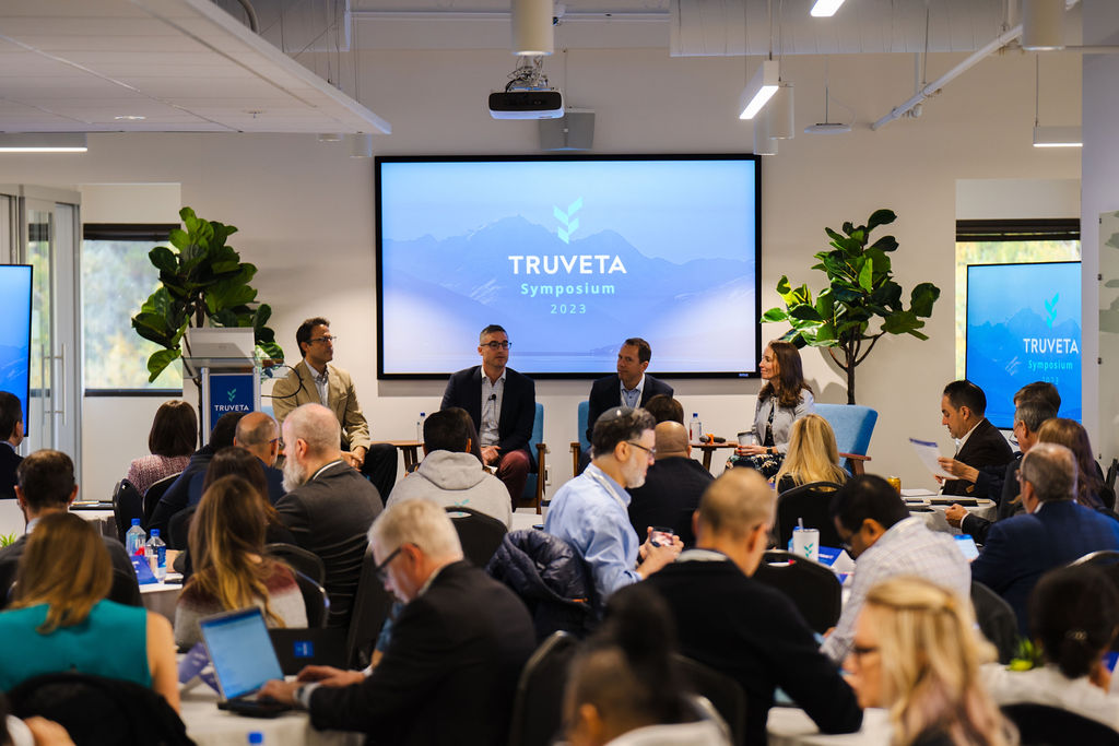Ryan Ahern, second from left, joins a four-person panel at the 2023 Truveta Symposium.