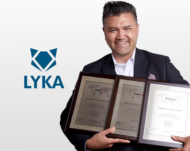 Ryan Baird holding award plaques beside the LYKA logo, in a photograph published in December 2021