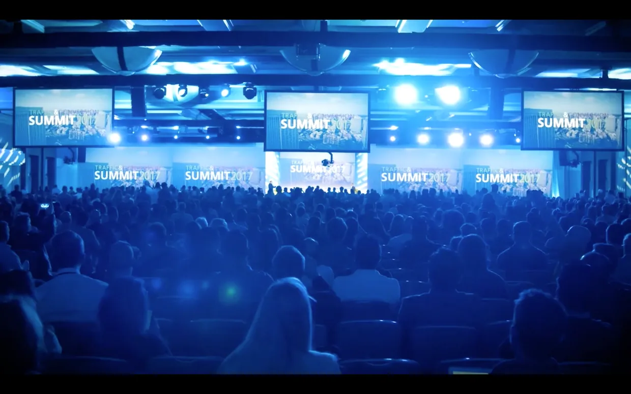 The Traffic and Conversion Summit stage and audience in a blue-lit ballroom in 2017