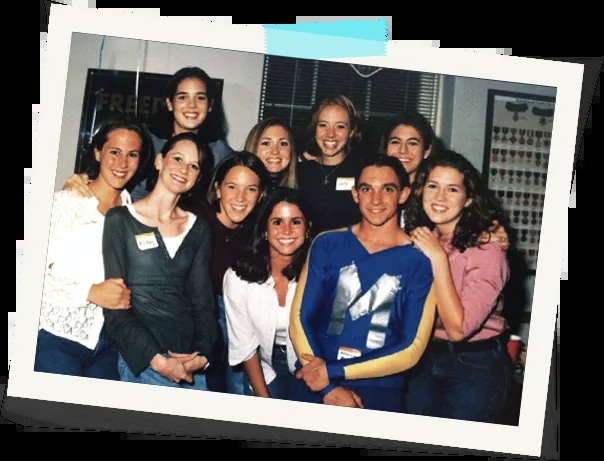 Ryan Deiss in his blue Millennium Man costume with fellow students at a 1999 party