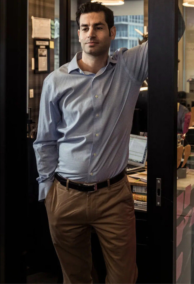 Ryan Feit standing in an office doorway beside a desk