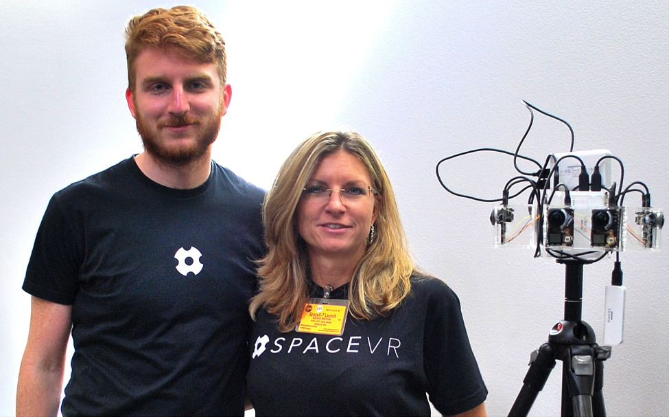 Ryan Holmes and Kelley Holmes standing beside the SpaceVR Overview One camera prototype at Kennedy Space Center