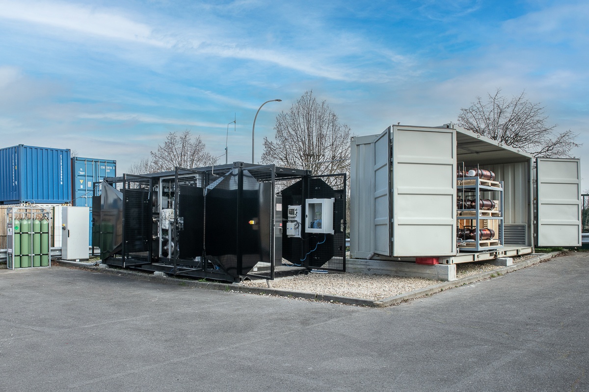 Industrial pilot equipment and an open shipping container at the plant shown by Loa Carbon
