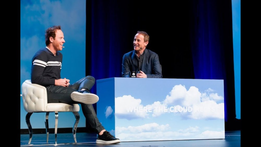 Ryan Smith, seated on the left, talks with Jason Lemkin onstage at SaaStr.