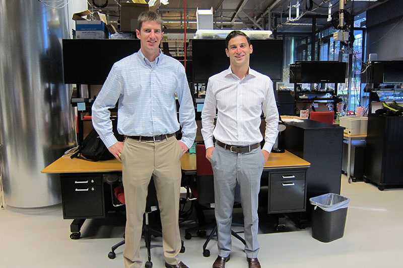 Rush Bartlett and Ryan Van Wert standing together in a Stanford workspace