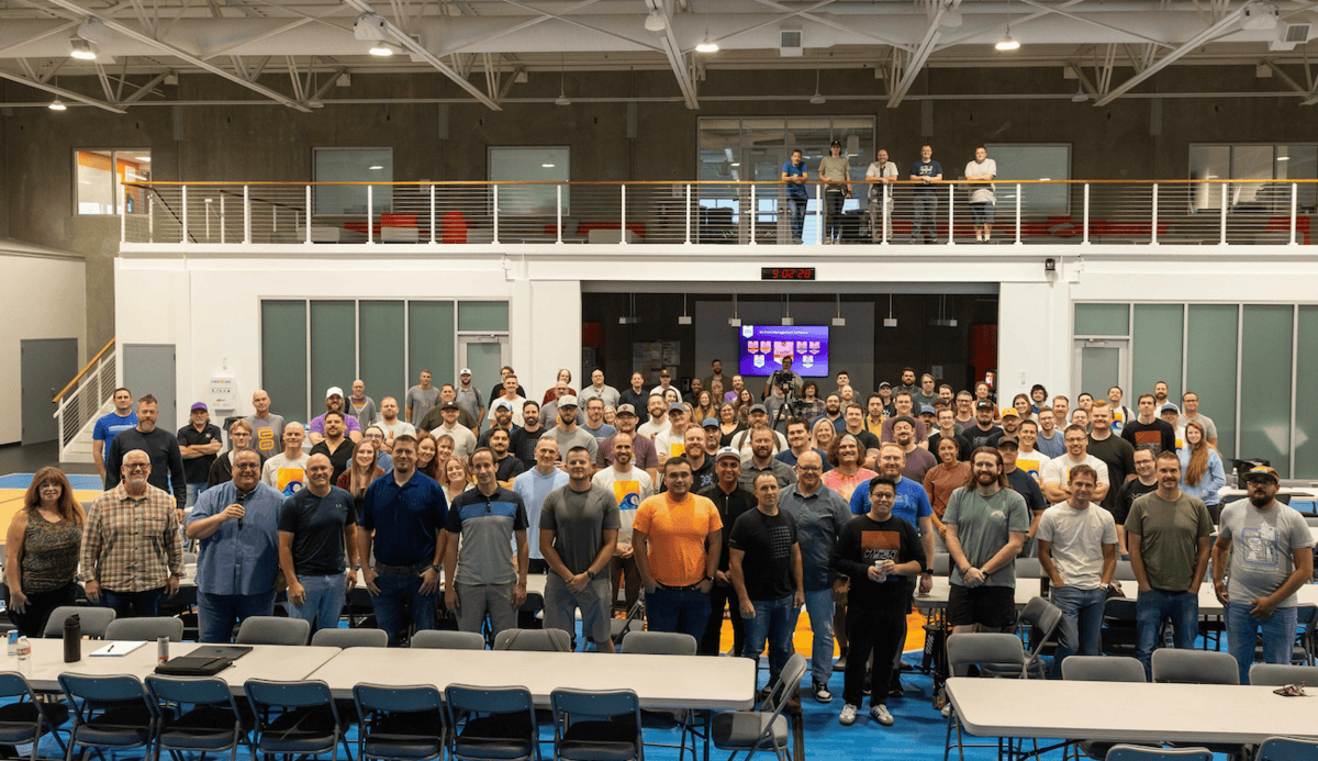 Vasion’s technology team gathered in an indoor meeting and recreation space at its 2025 annual summit