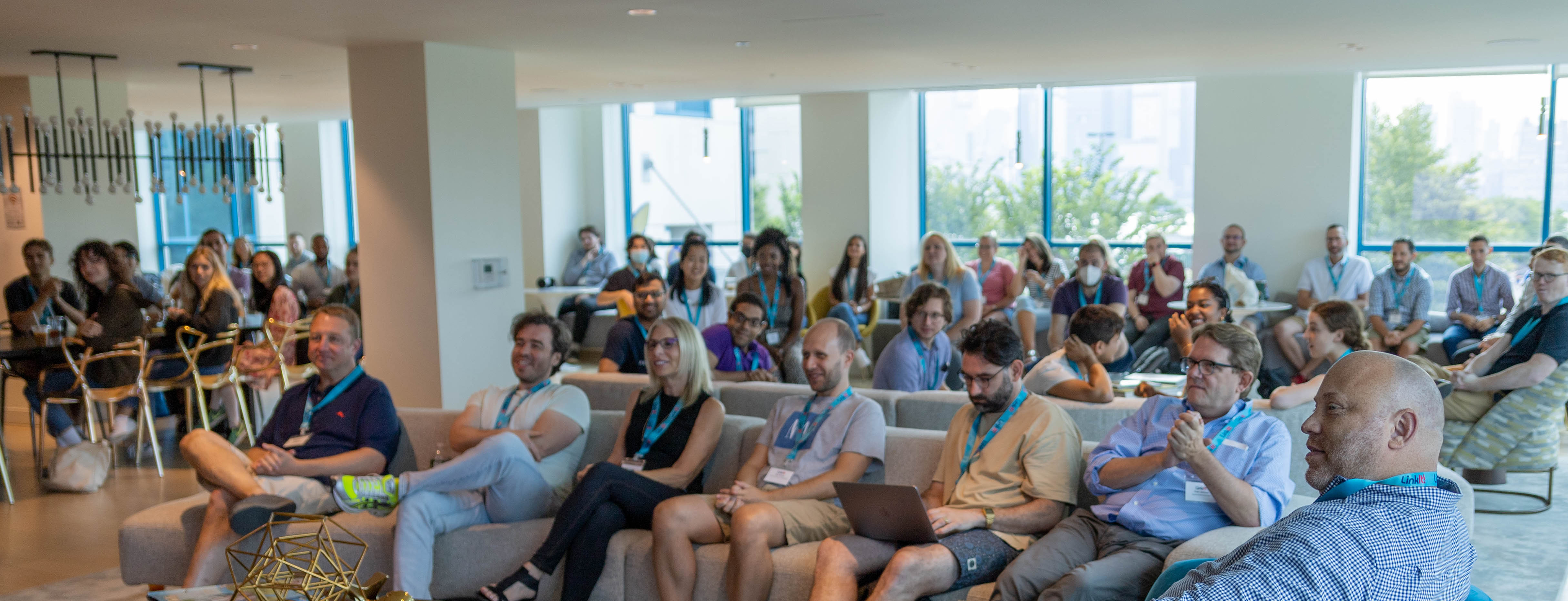 LinkIt! colleagues seated together during a company retreat