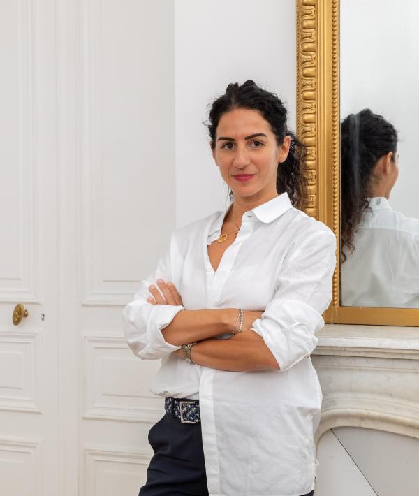 S2H Communication founder Sarah Hamon standing beside a gilt mirror