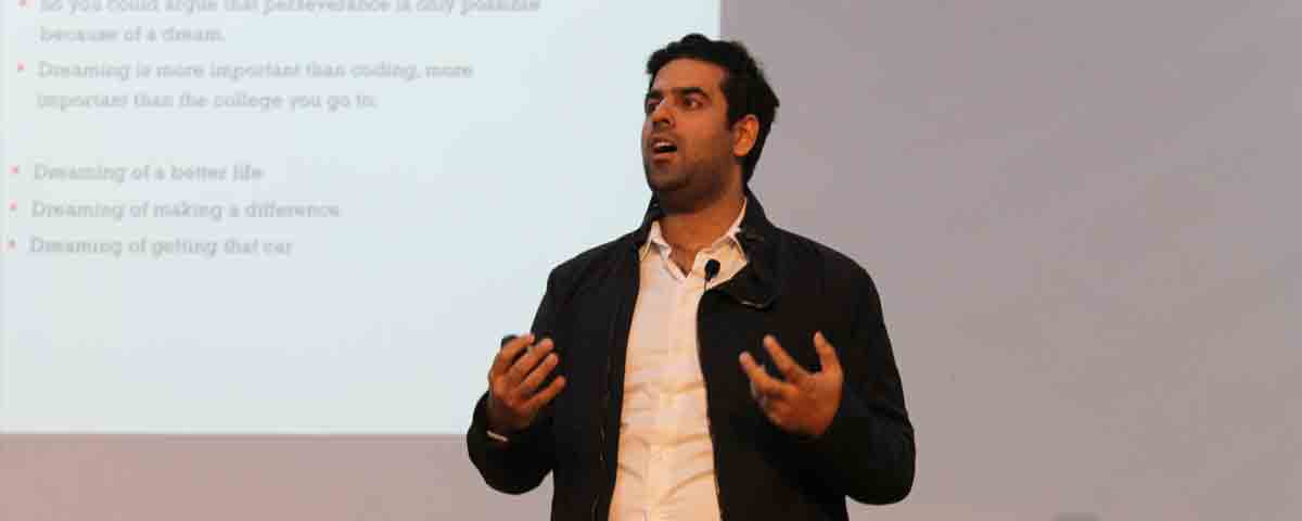 Sachin Dev Duggal speaking during his return visit to Queen Elizabeth’s School