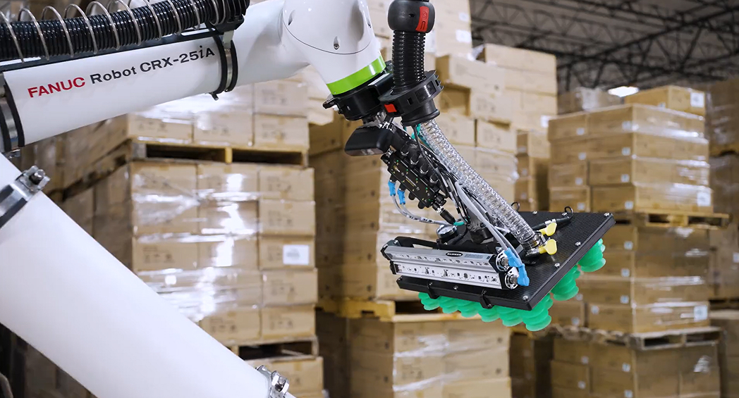 FANUC collaborative robot arm and box-handling gripper in the Saddle Creek automation case