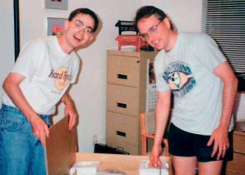 Safe Software founders Don Murray and Dale Lutz unpacking equipment in the company's early days