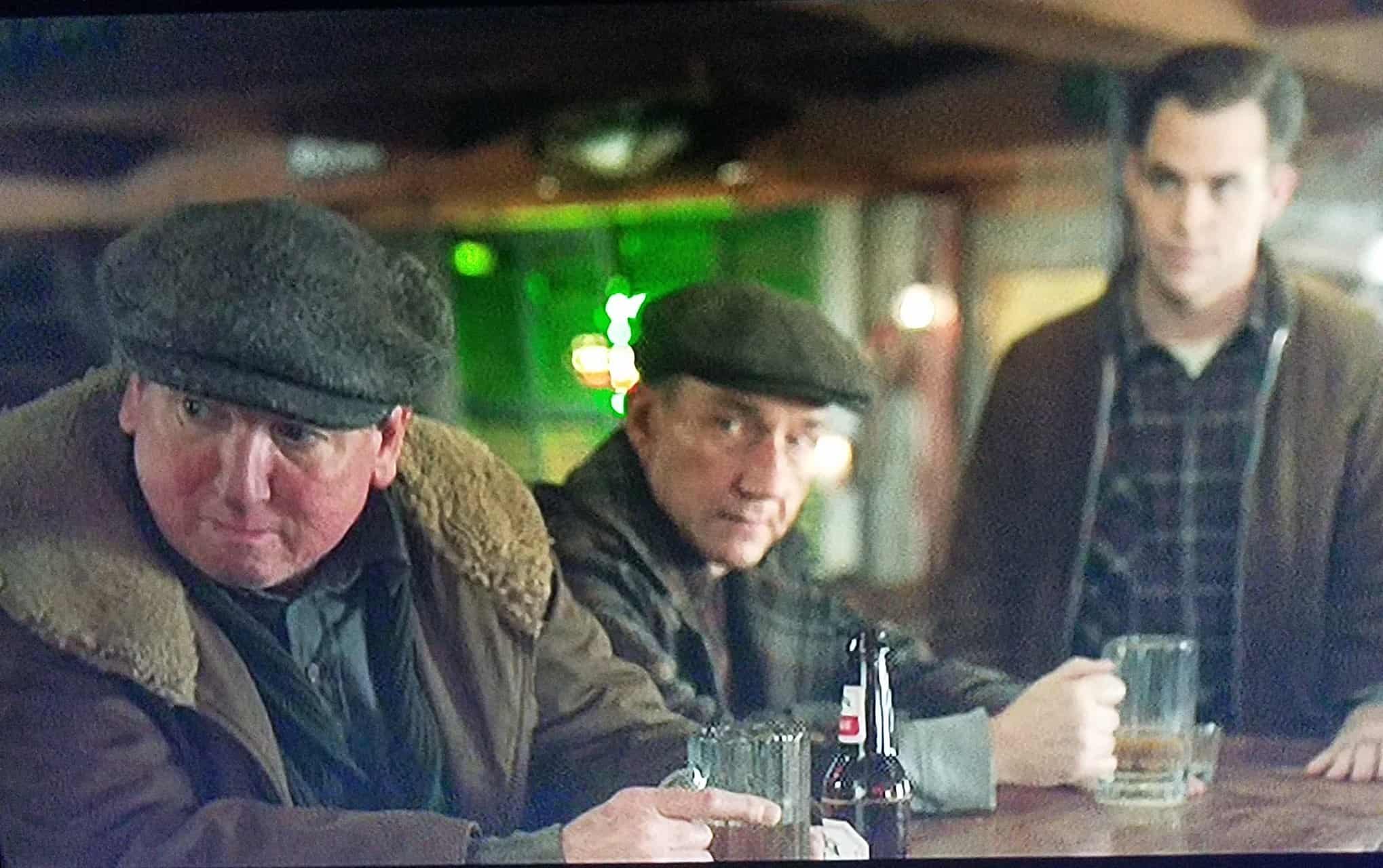 Danny Connelly at the left of a bar scene in The Finest Hours, alongside two other performers.