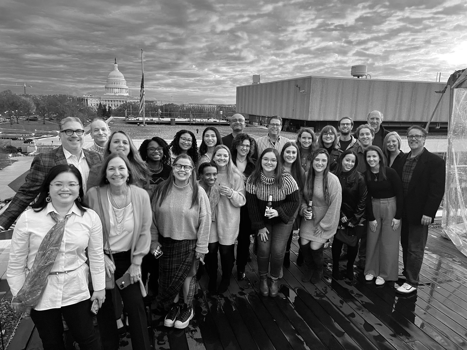 The Sage Communications team gathered together on a rooftop
