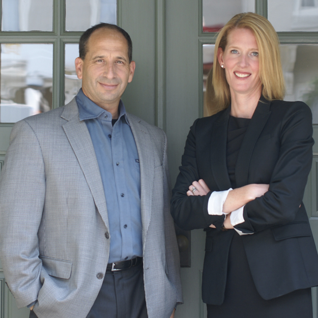 Sagefrog co-founders Mark Schmukler and Suzanne Morris standing together
