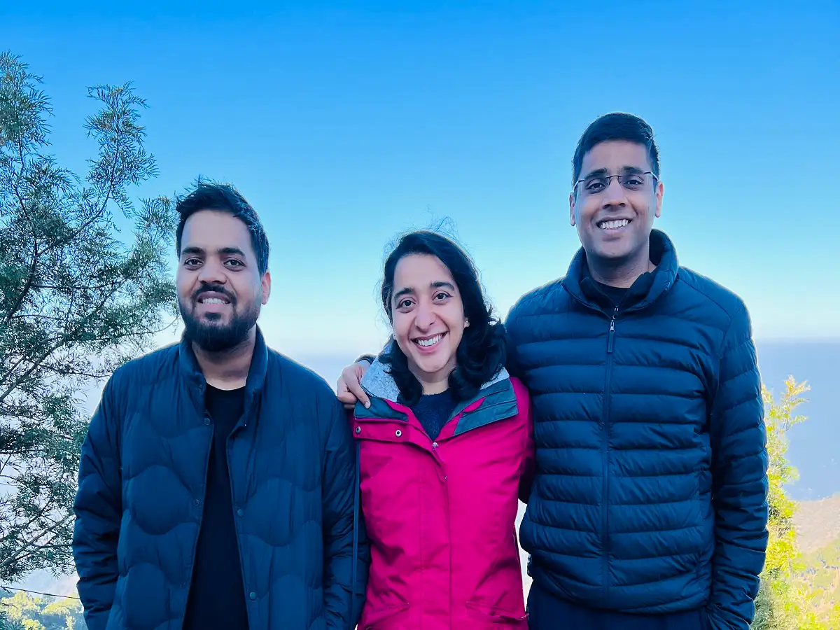 Rattle co-founders Milan Singh, Apoorva Verma and Sahil Aggarwal standing together outdoors
